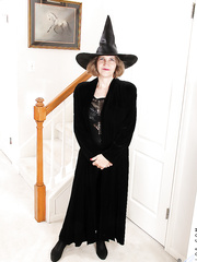 Smiley older lady in cosplay outfit undressing and teasing her gash