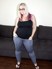 Chubby honey with dyed hair does a striptease prior to interracial fucking