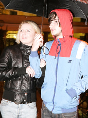 Youthful golden-haired hotty with short hair does a double penetration on a rainy day