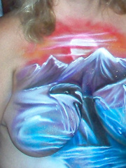 Painted tits at a biker rally for all to see had lots of pics taken