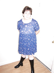 Blue baby doll dress and tall black boots with a shaved pussy