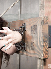 Breasty hottie Syren De Mer is restrained in place and made to engulf rod