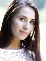 Solo angel with a valuable arse and firm mambos showcases her shaved cunt in a field