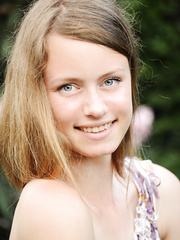 Lengthy haired Milana K in mini suit on knees showing hawt a-hole on the steps