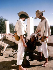 Retro pornstar bangs a pair of boys out for ride in bush in a Jeep