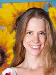 Smiley blue eyed April flashes her curly love tunnel and widens nude on her ottoman