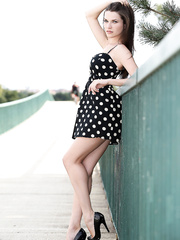 Solo cutie removes her polka dot suit whilst out for a walk in public