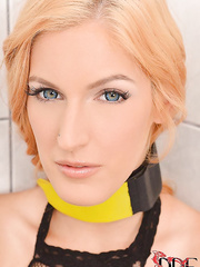 Mesh stocking attired golden-haired S&M fetish model Mira Sunset pissing in bathroom