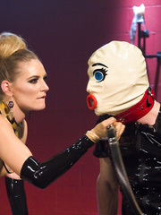 Male sub in latex and a hood acquires pegged by slaver female Mona Wales
