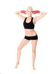 Golden-Haired kick boxer Melody Powers removes spandex attire to pose exposed