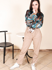 Brunette Hair gal next door Ilaria frees her pretty feet from canvas sneakers