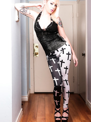 Sexy goth Nicole Malice undresses to pose her nude tattooed body suggestively