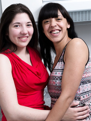 Yong dark brown lesbo paramours undressing to take up with the tongue unshaved love tunnel in the kitchen