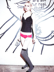 College babe Lacey Craving plays with bald snatch in front of graffiti wall