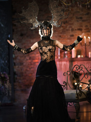 Slender legal age teenager chick in high heels and cosplay outfit modeling for glamour pictures