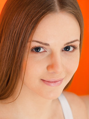 Glamorous youthful beauty Leanisa slipping out of short costume to model in the stripped