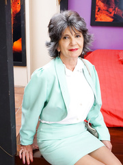 Nasty grandmother with great legs disrobes down to her brassiere and underclothes