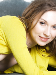 Smiling amenable dark brown does the splits to show her sexy love tunnel on the daybed