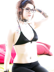 Glasses wearing alt hottie Severin Graves displaying tiny bazookas and tattoos