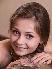 Youthful erotica model Ennu A posing undressed body in teasing manner on couch