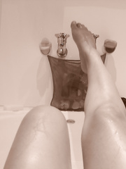 Taking some pictures of my wife in the bath tub and sexy lingerie