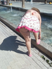 Walking around in a short dress without knickers bending over