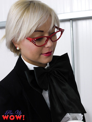 Nerdy Oriental model Petra Lily So disrobes down to her stockings and garters