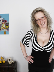 Hawt German housewife squeezes her large juggs and licks hot teats