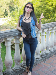 Brazen Denisse Gomez hangs out on the patio in sheer hose and white belt