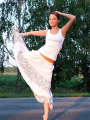 Graceful Nikia flashes a bare upskirt & positions merry titted & in nature's garb in the car