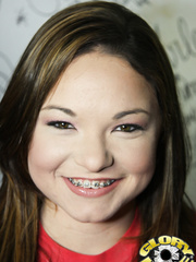 Youthful dark brown with braces Leenah Rae enjoys interracial sex at gloryhole