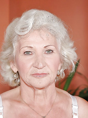 Sexually Excited granny in white nylons masturbating her slit with a large sex tool