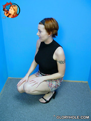 Redheaded hottie Alisha Girl receives on her knees to blow a BBC at a gloryhole