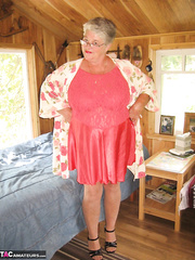 Short haired granny Girdle Dominatrix-Bitch stripping to her nylons and high heels