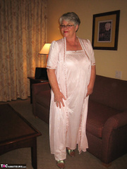 Dilettante granny on the enormous side shows her cookie in underware and tan stockings