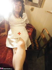 Aged lady Caro gest decked out in nasty nurse attire for a live livecam show