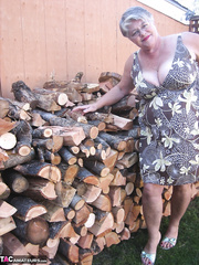Brazen mature granny undresses off by the wood pile to show off big beautiful woman bra buddies & large booty