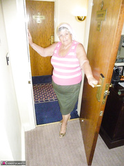 Chubby grandmother licks her own teats as that babe disrobes undressed in living room
