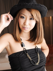 Hot Japanese hotty uncovers her worthwhile whoppers and bush as this babe undresses nude