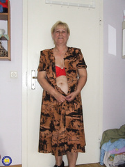 Fatty granny with saggy pantoons removes red underware and positions exposed in bedroom