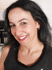 Granny Nina demonstrates her ravishing large boobies in the kitchen