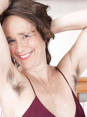 Aged lady with large zeppelins shows off her indeed hirsute bush for the 1st time