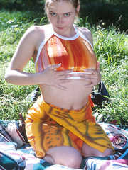 Breasty non-professional toys and fingers her wet crack on blanket in the forest