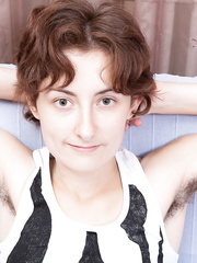 Thin 1st timer displays her furry armpits and beaver in the stripped