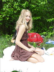 Lascivious doxy in boots bows over on a fallen tree to show off her hawt in nature's garb butt