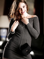 Dressed pornstar Jodi Taylor freeing flat chest and bush from slinky costume