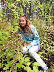 Dilettante model Katya positions fully dressed for her photographer ally