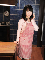 Japanese housewife with a marvelous face positions non stripped in her kitchen