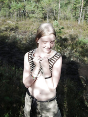 Outdoor posing with gorgeous legal age teenager chick showing her wazoo in woods