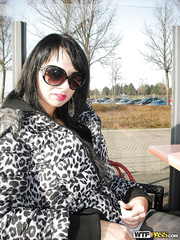 Horny dark brown sweetheart in sunglasses uncovering her fuckable curves outdoor